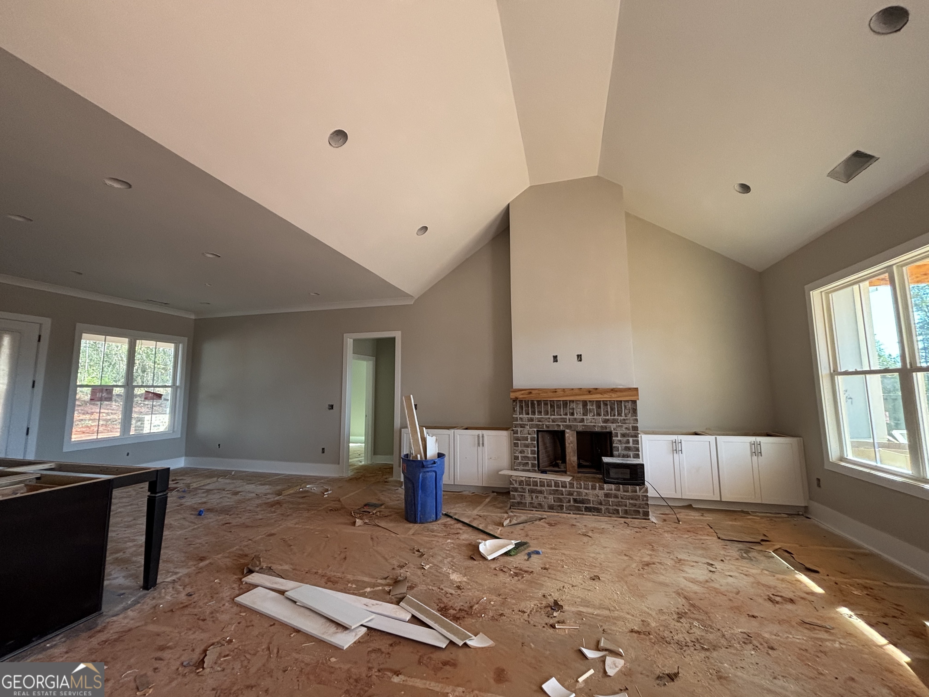 125 Hawthorne Lane Forsyth, GA 31029 - Photo 5 of 19 a living room with furniture and a fireplace