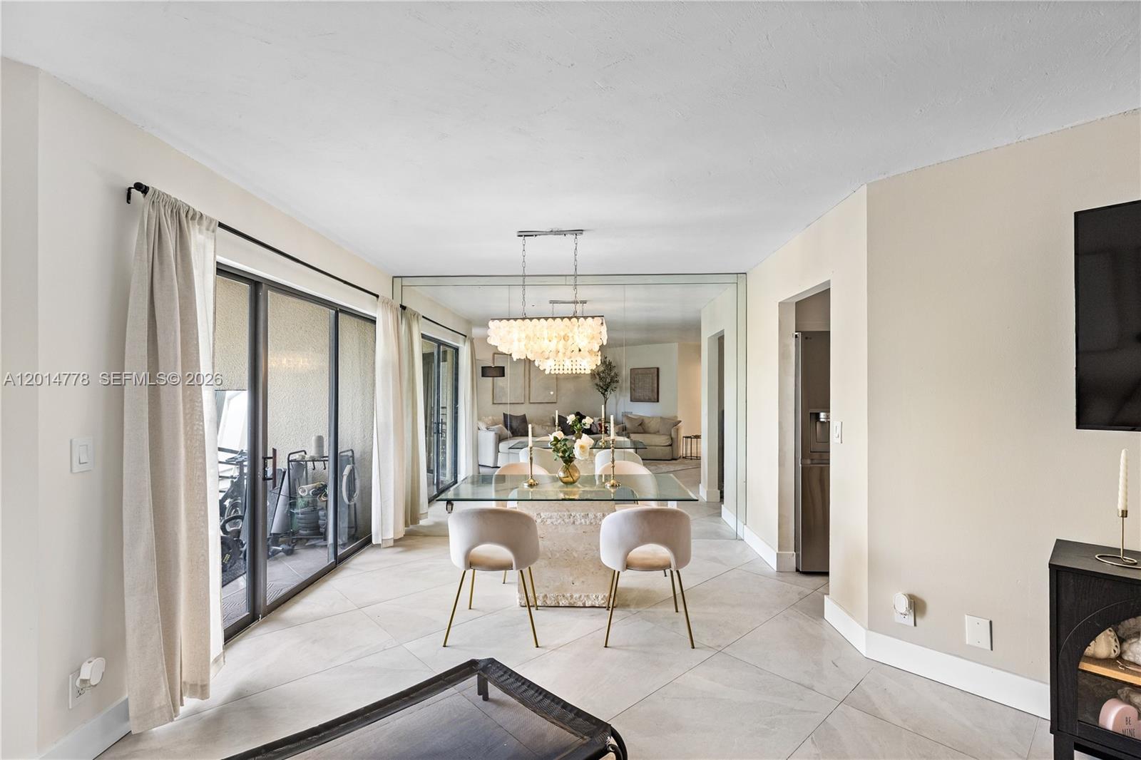 5850 Camino Del Sol, Unit 404 Boca Raton, FL 33433 - Photo 12 of 47 a dining room with furniture and a window