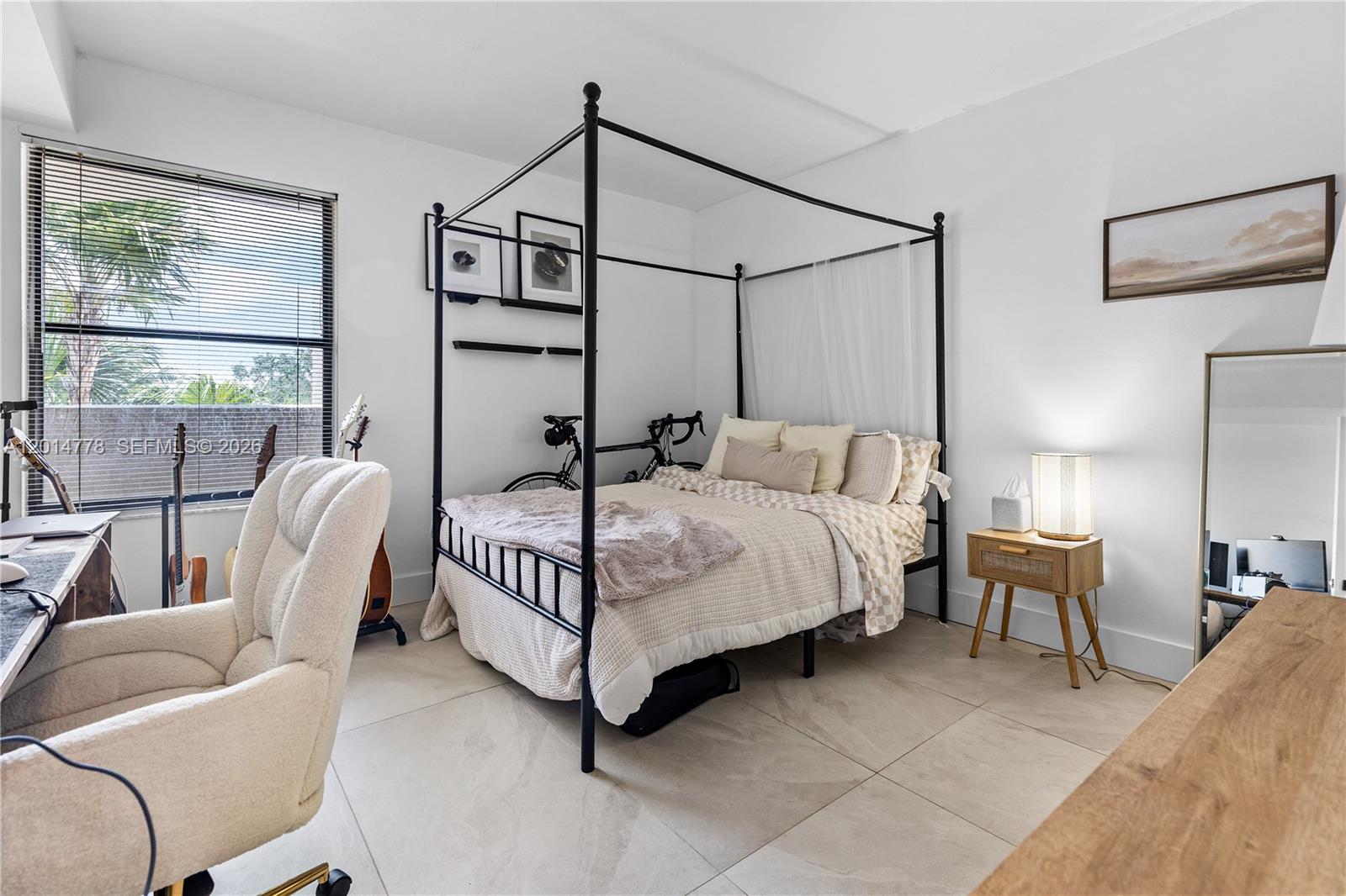 5850 Camino Del Sol, Unit 404 Boca Raton, FL 33433 - Photo 20 of 47 a bedroom with a bed and a couch