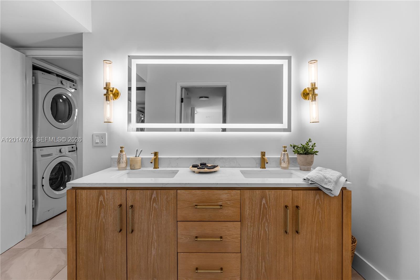 5850 Camino Del Sol, Unit 404 Boca Raton, FL 33433 - Photo 23 of 47 a utility room with sink dryer and washer