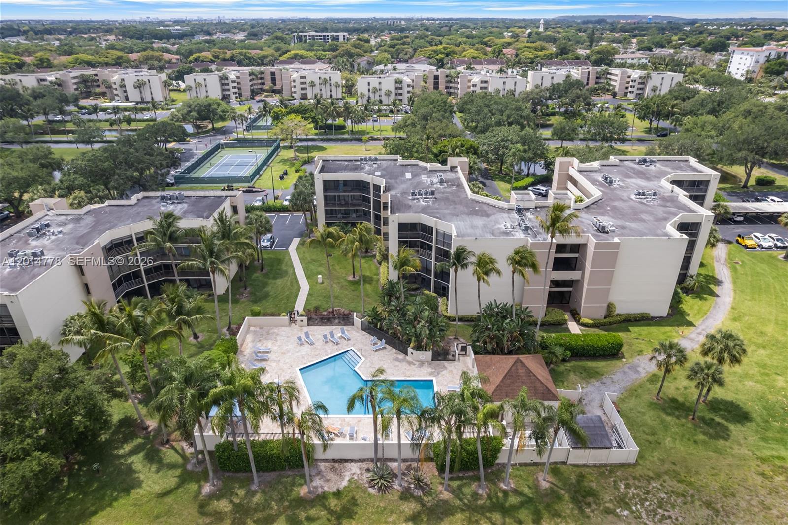 5850 Camino Del Sol, Unit 404 Boca Raton, FL 33433 - Photo 36 of 47 an aerial view of residential houses with outdoor space and parking