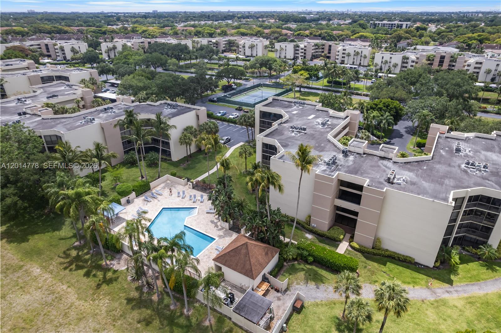 5850 Camino Del Sol, Unit 404 Boca Raton, FL 33433 - Photo 41 of 47 an aerial view of residential houses with outdoor space