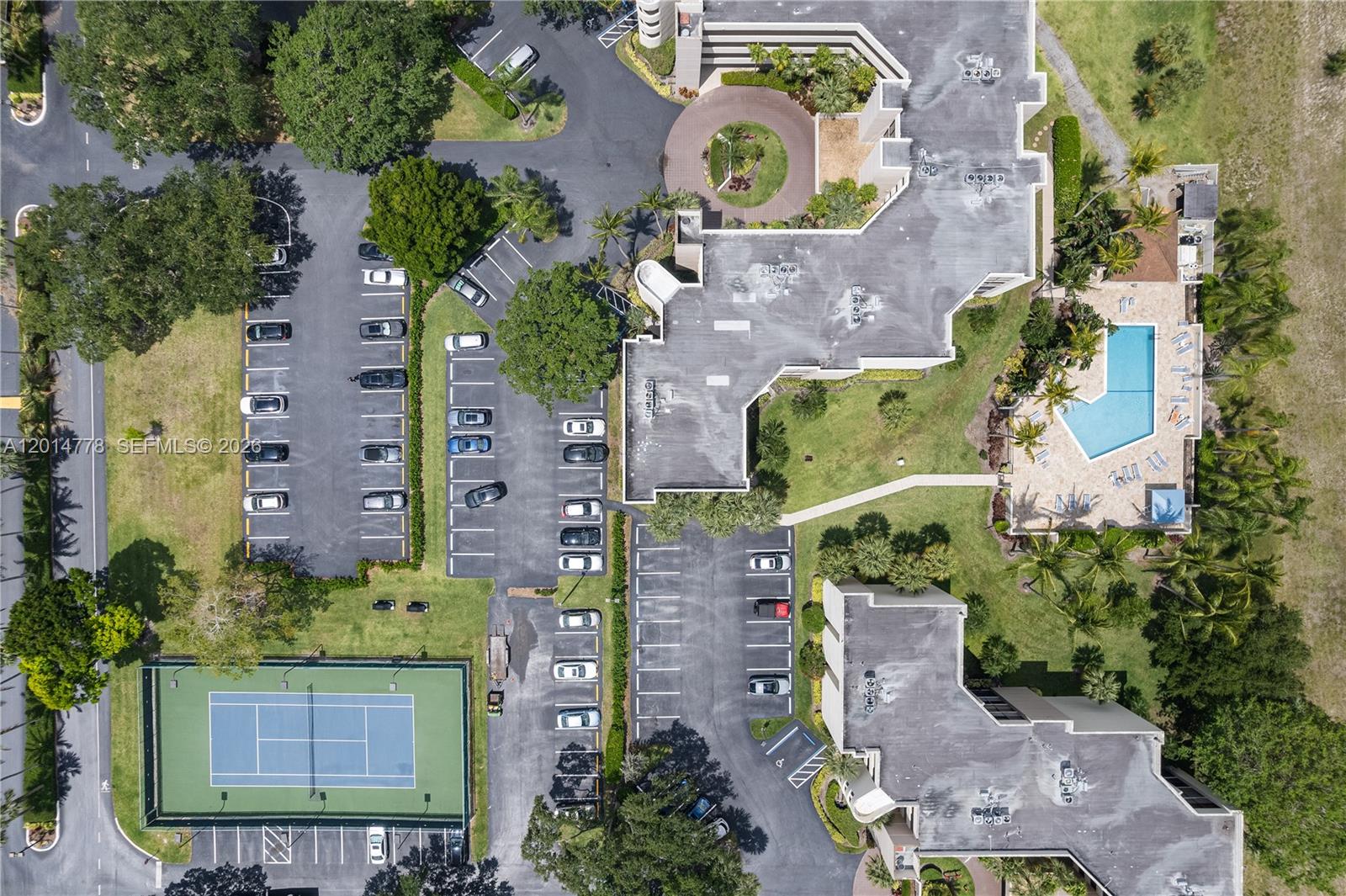 5850 Camino Del Sol, Unit 404 Boca Raton, FL 33433 - Photo 44 of 47 an aerial view of residential house with outdoor space and parking