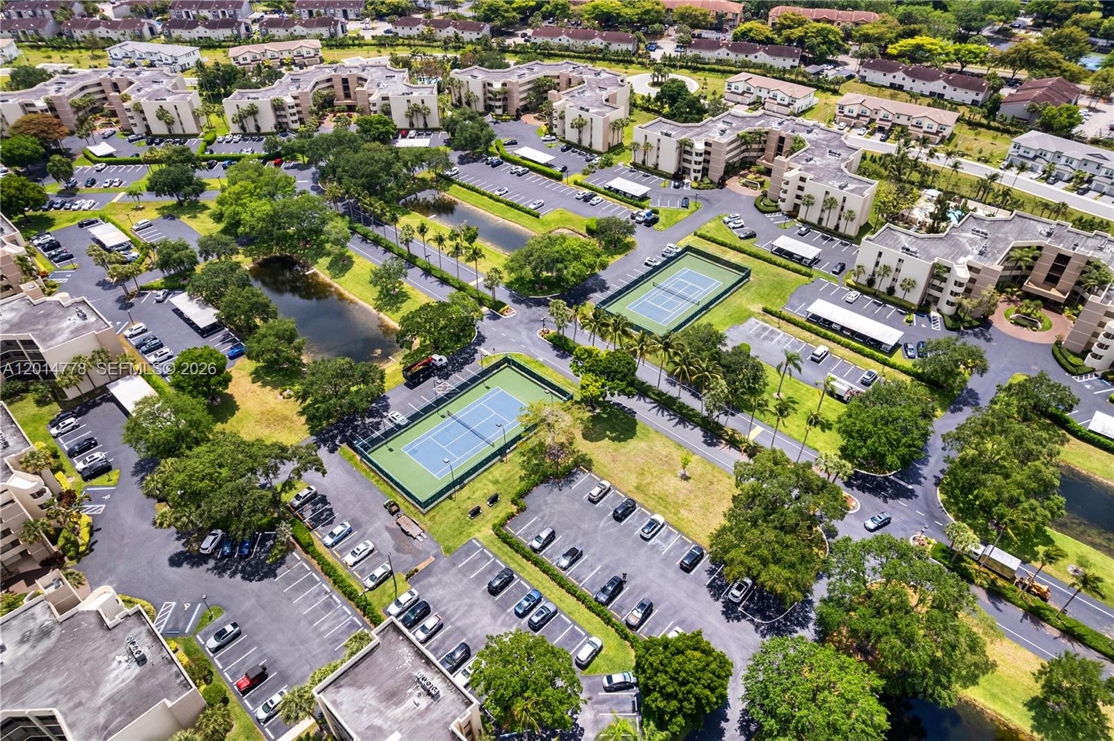 5850 Camino Del Sol, Unit 404 Boca Raton, FL 33433 - Photo 45 of 47 an aerial view of a city