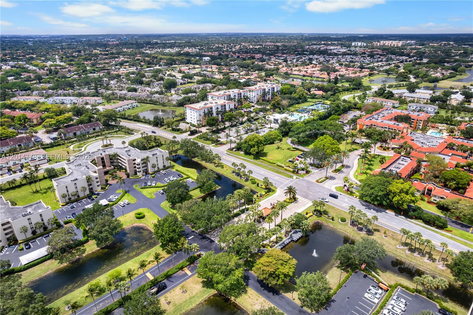 5850 Camino Del Sol, Unit 404 Boca Raton, FL 33433 - Photo 46 of 47 an aerial view of multiple house