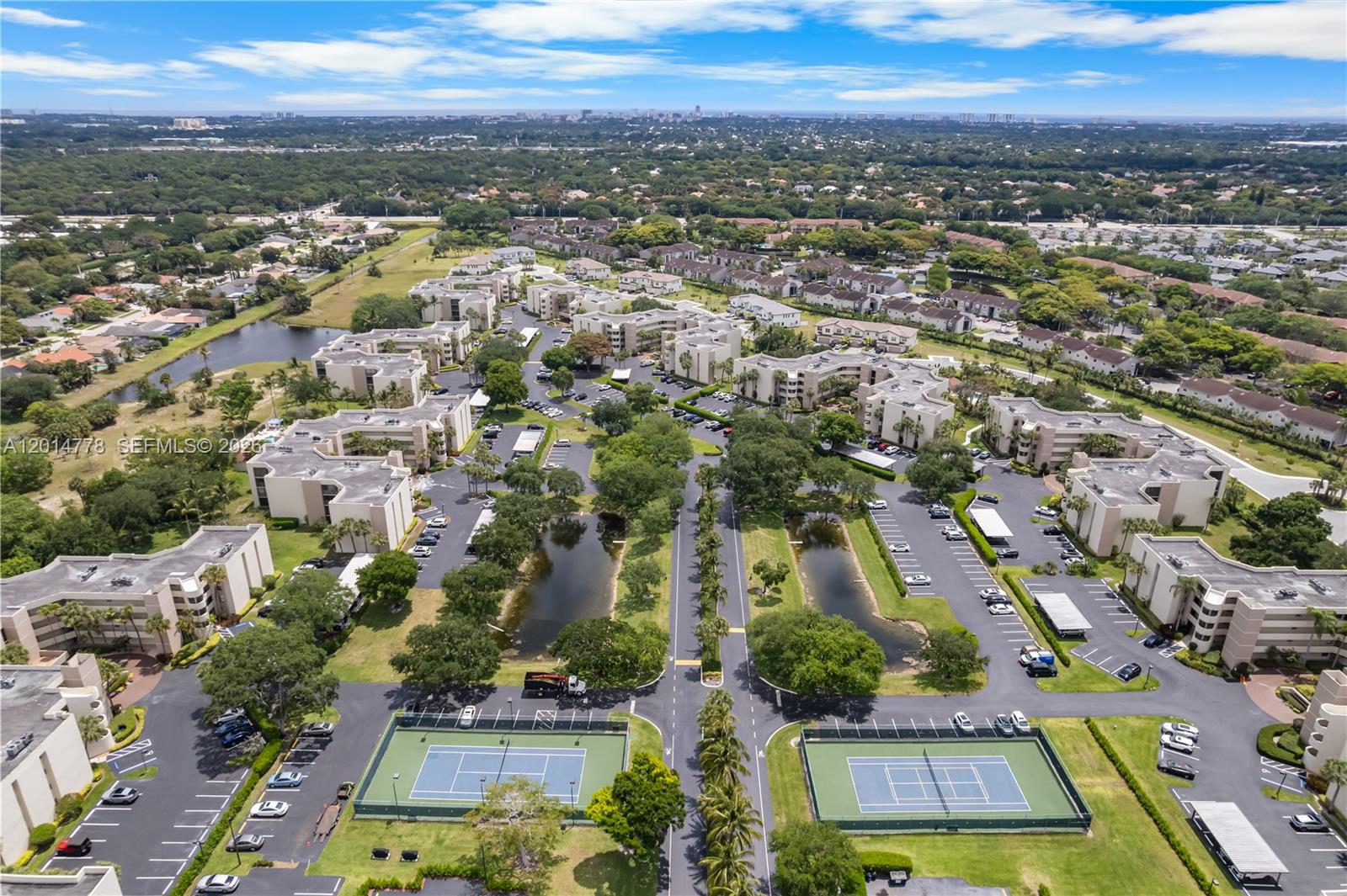 5850 Camino Del Sol, Unit 404 Boca Raton, FL 33433 - Photo 47 of 47 an aerial view of residential houses with outdoor space