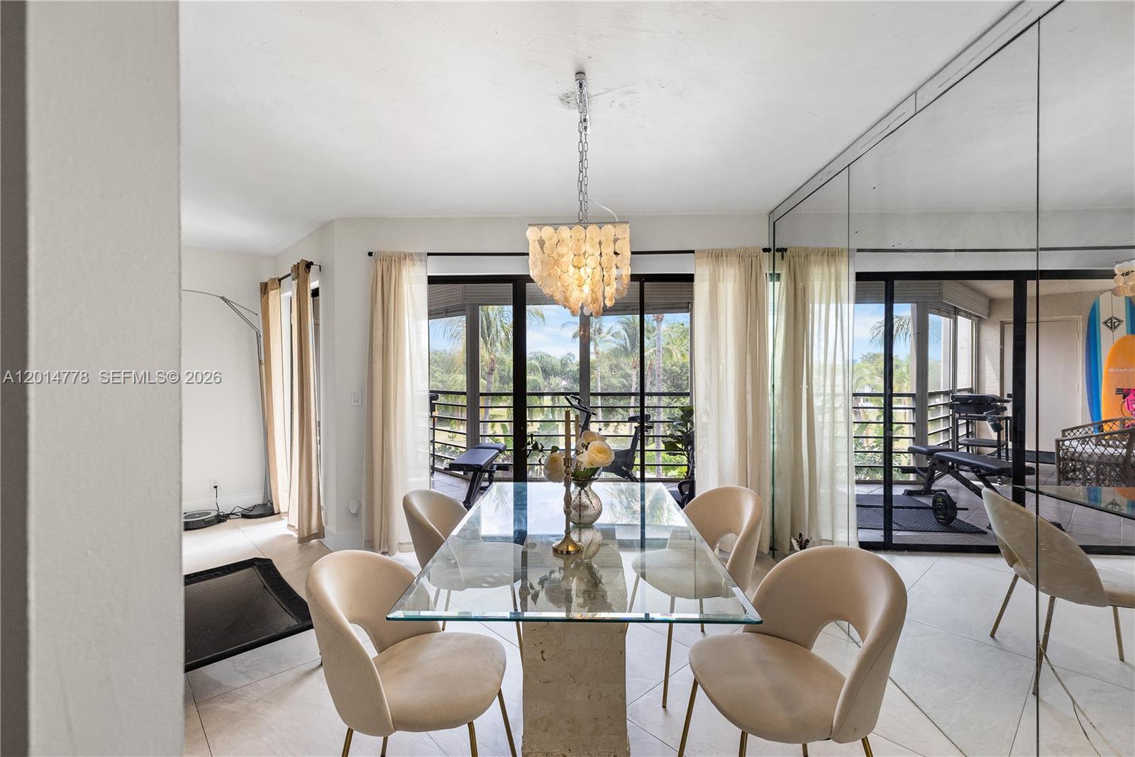 5850 Camino Del Sol, Unit 404 Boca Raton, FL 33433 - Photo 8 of 47 a view of a dining room with furniture window and outside view