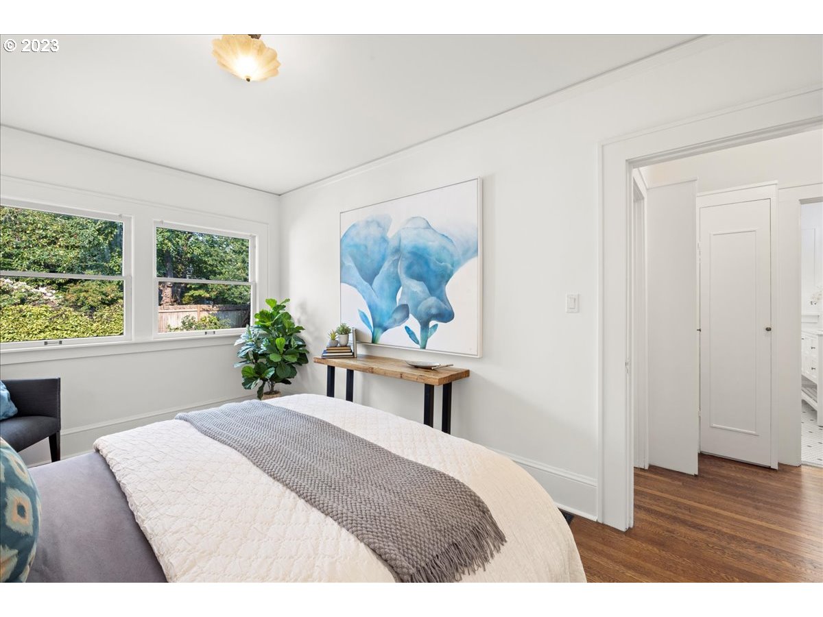 2015 Northeast 38th Avenue Portland, OR 97212 - Photo 19 of 32 a bedroom with a bed and a painting on the wall