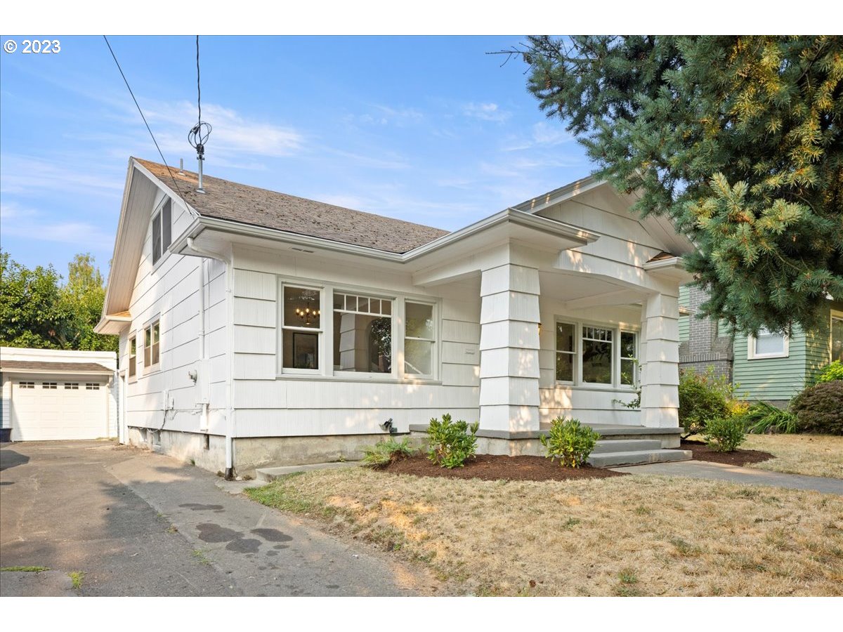 2015 Northeast 38th Avenue Portland, OR 97212 - Photo 2 of 32 a front view of a house with a yard