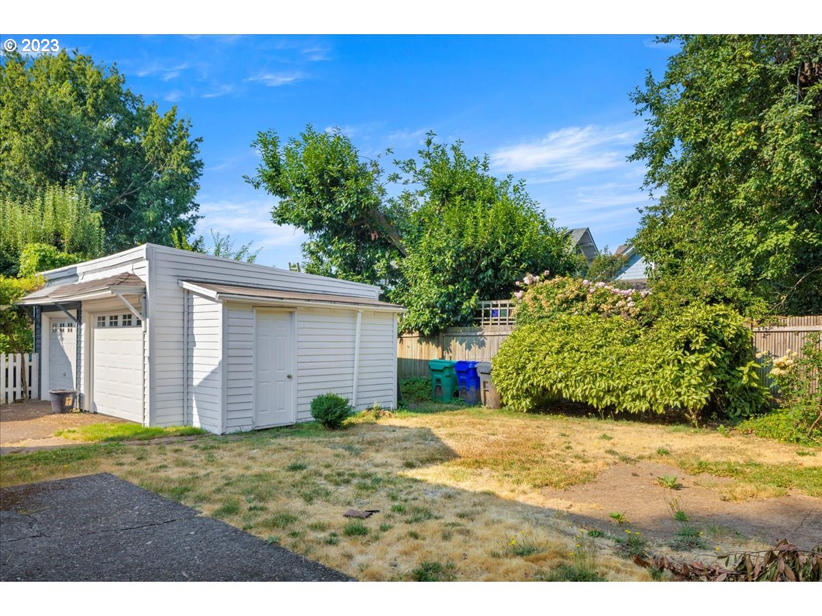 2015 Northeast 38th Avenue Portland, OR 97212 - Photo 29 of 32 a view of a backyard with plants and large tree