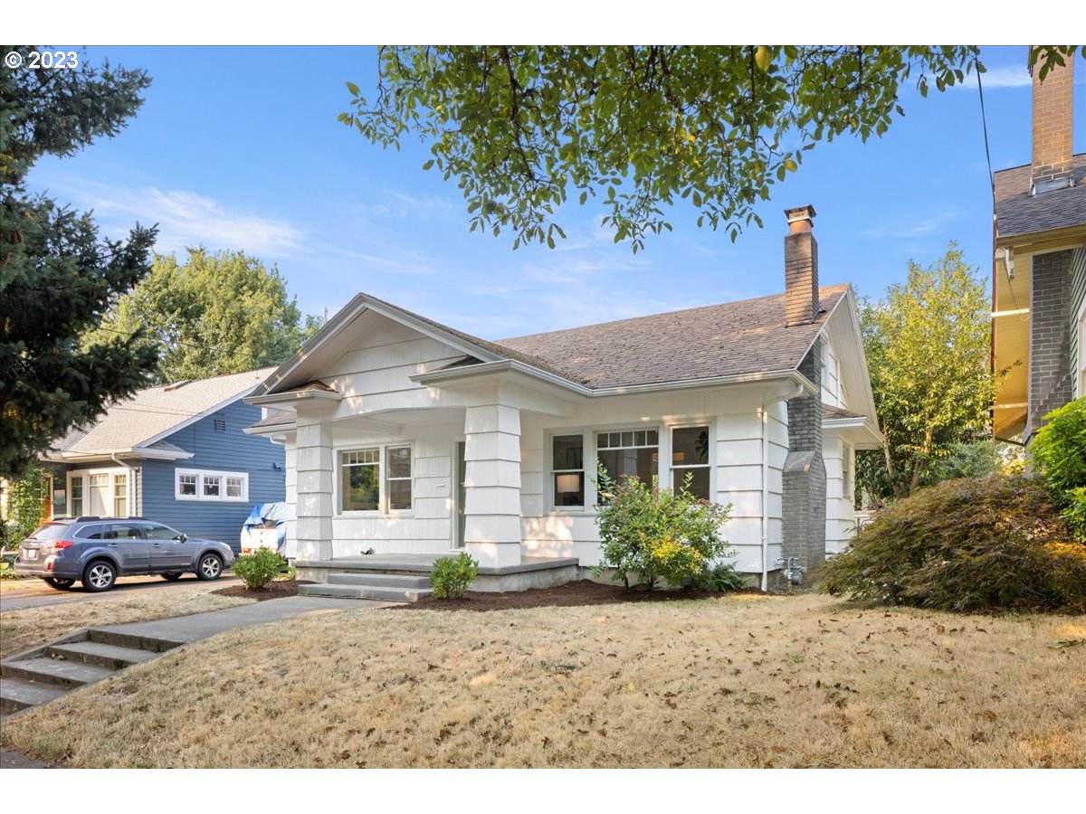 2015 Northeast 38th Avenue Portland, OR 97212 - Photo 3 of 32 a front view of a house with a garden