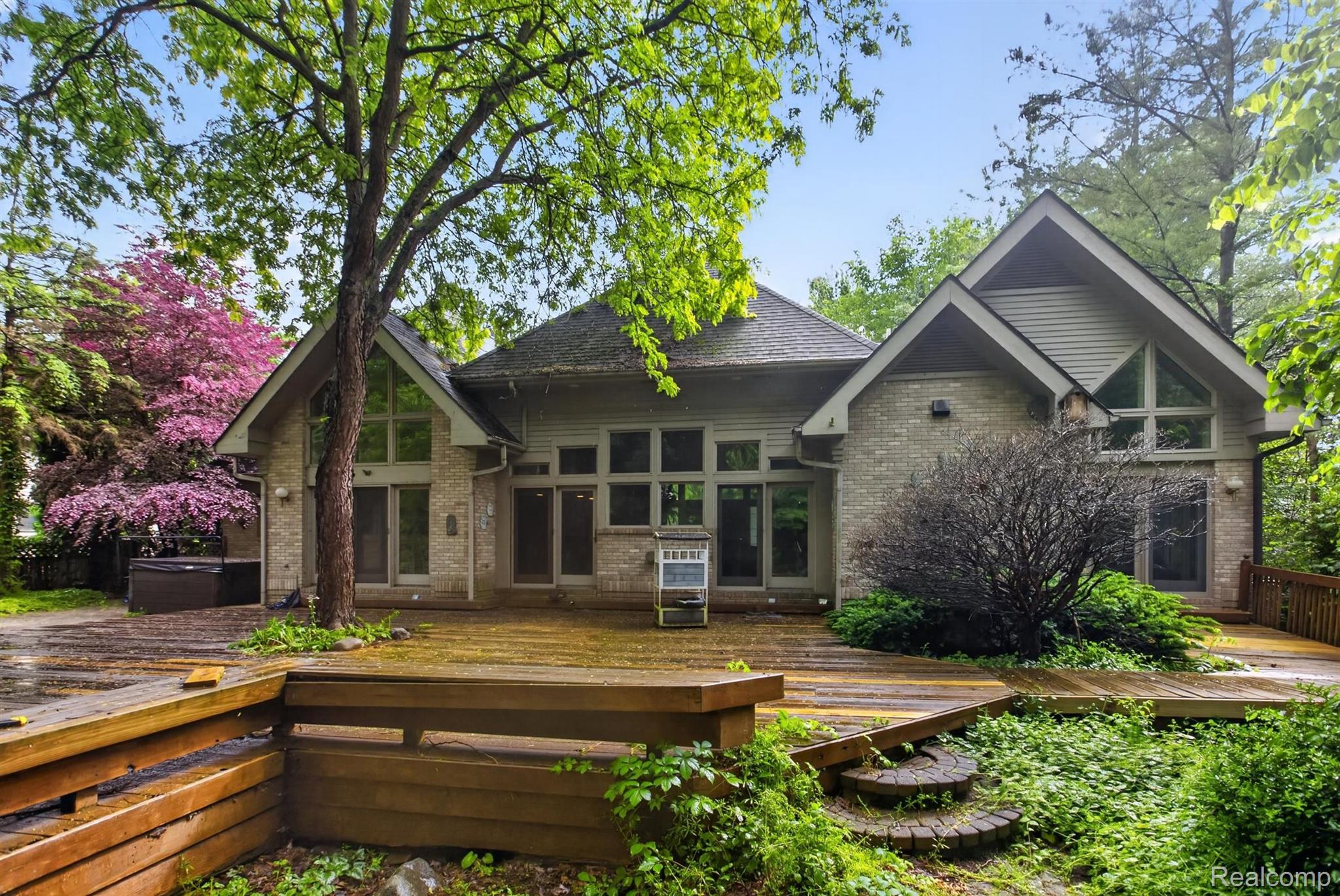 2197 South State Road Davison, MI 48423 - Photo 69 of 72 Expansive wood deck surrounding a residence featuring brick and siding exteriors