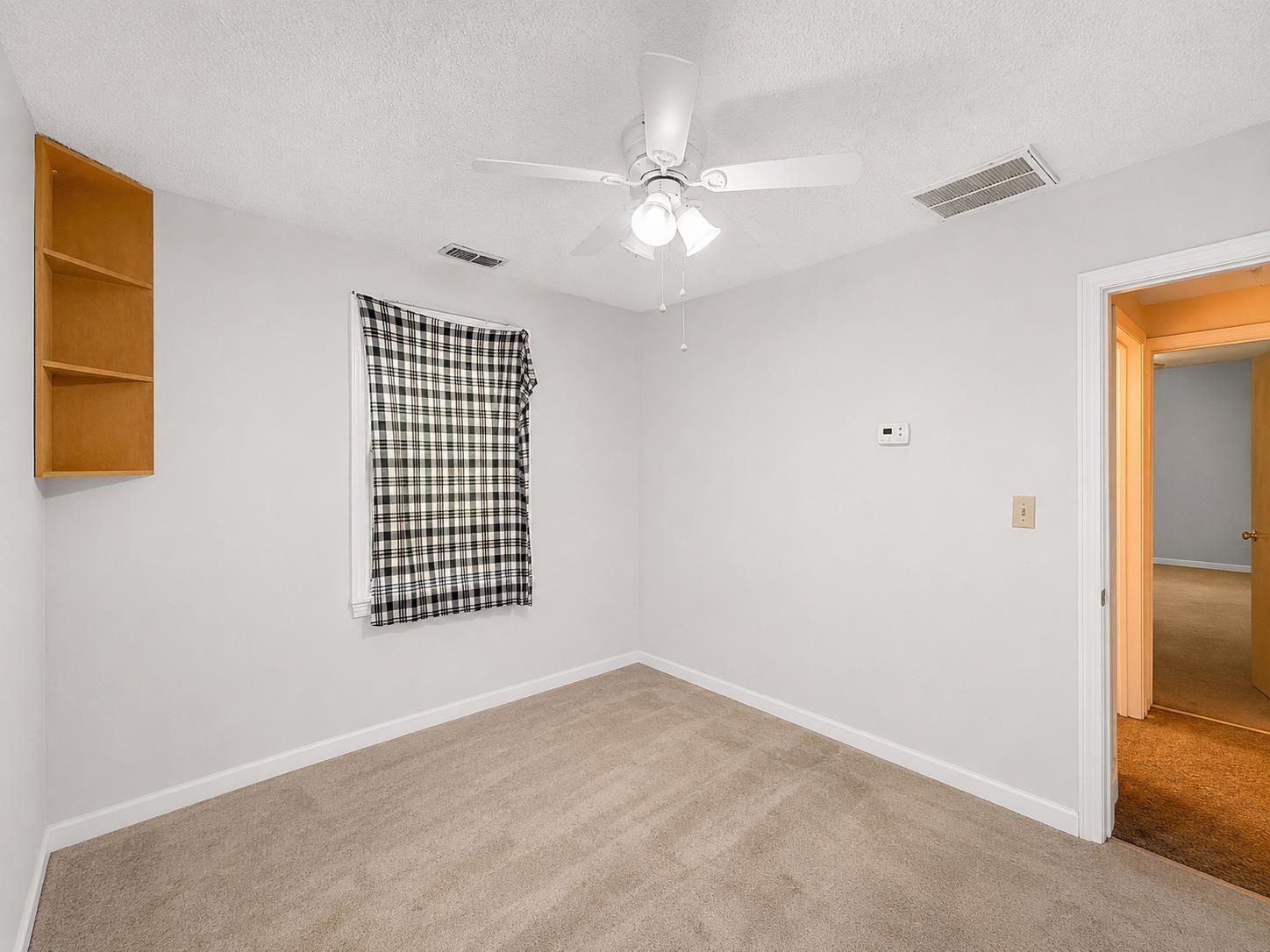 8488 Quito Road Millington, TN 38053 - Photo 20 of 30 an empty room with windows and fan