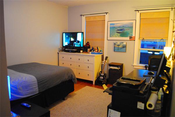 421 East 3rd Street, Unit 2 Boston, MA 02127 - Photo 11 of 25 a bedroom with a bed and a flat tv screen on dresser
