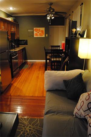 421 East 3rd Street, Unit 2 Boston, MA 02127 - Photo 6 of 25 a living room with furniture a chandelier and a flat screen tv