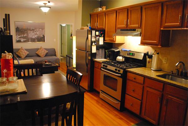 421 East 3rd Street, Unit 2 Boston, MA 02127 - Photo 8 of 25 a kitchen with stainless steel appliances granite countertop a stove refrigerator sink and cabinets
