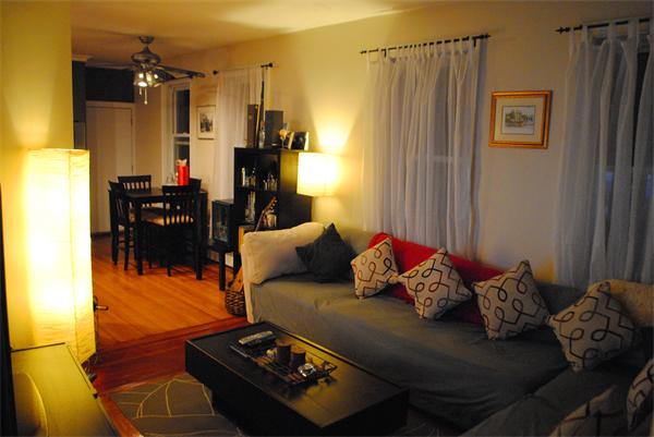 421 East 3rd Street, Unit 2 Boston, MA 02127 - Photo 9 of 25 a living room with furniture and a chandelier