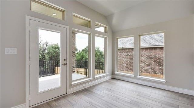 2017 Limestone Lake Drive Georgetown, TX 78633 - Photo 13 of 25 a view of an empty room with wooden floor and a window