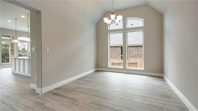 2017 Limestone Lake Drive Georgetown, TX 78633 - Photo 15 of 25 an empty room with wooden floor and windows