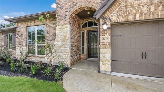 2017 Limestone Lake Drive Georgetown, TX 78633 - Photo 3 of 25 a front view of a house with a yard
