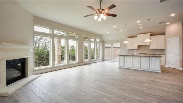 a kitchen with granite countertop a sink and cabinets