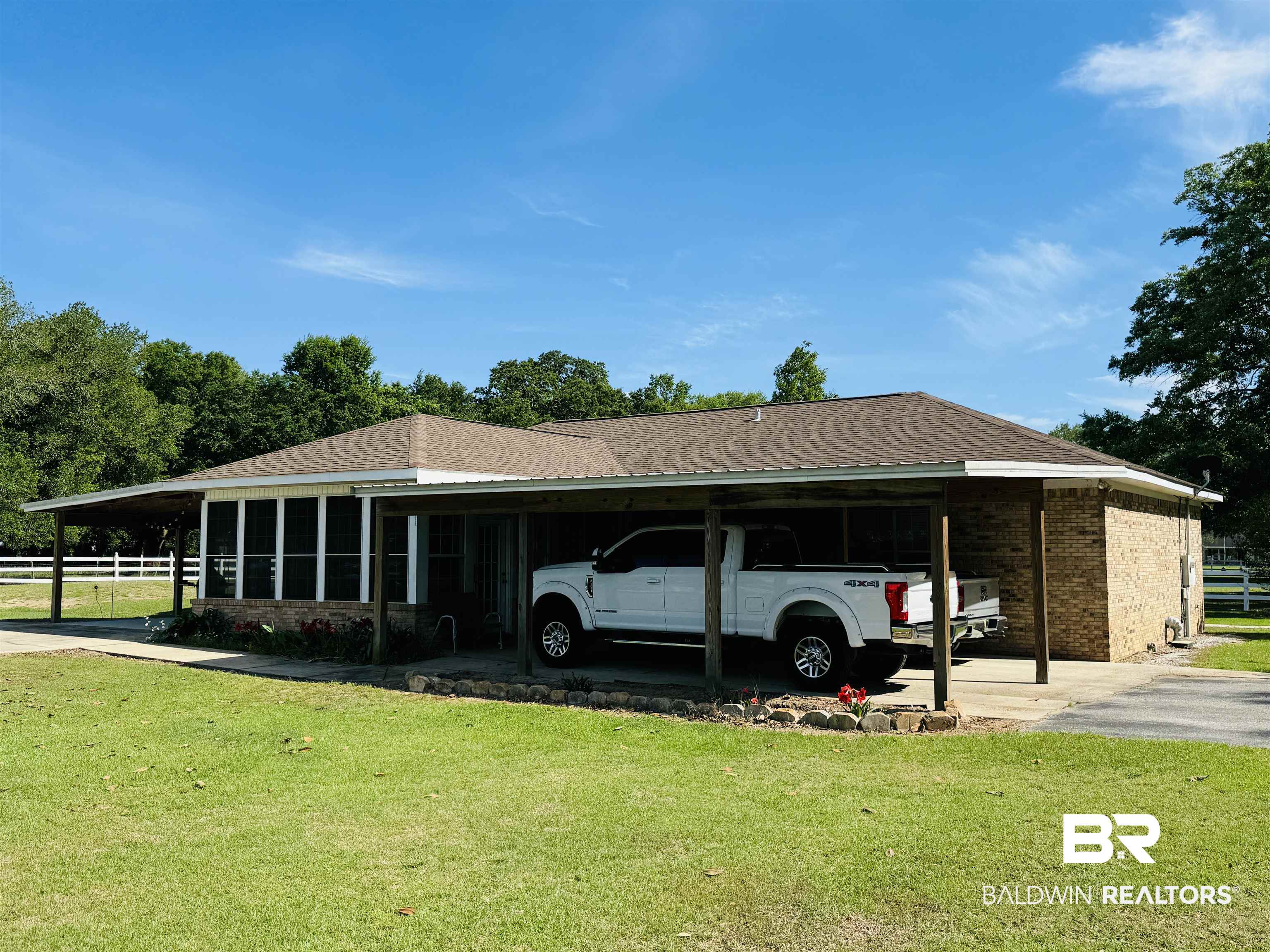 13795 White Road Silverhill, AL 36576 - Photo 18 of 99 View of side of property featuring a lawn, a carport, a shingled roof, and brick siding