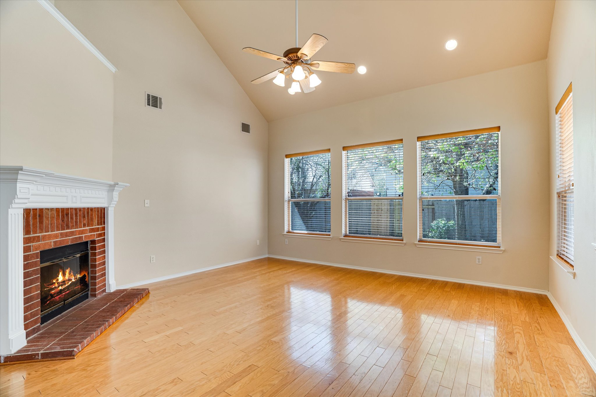 2207 Clover Ridge Drive Cedar Park, TX 78613 - Photo 8 of 25 Living room with a high ceiling wood floor and a fireplace
