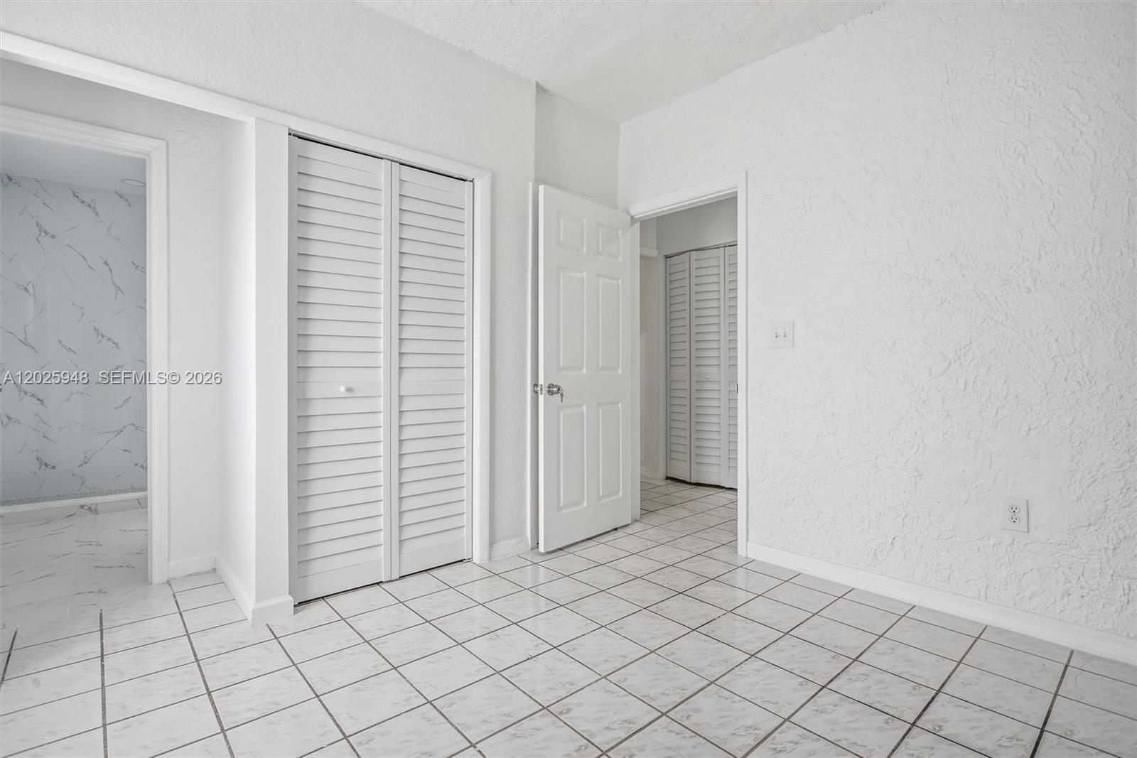 1745 Southwest 17th Street, Unit 2 Miami, FL 33145 - Photo 15 of 32 an empty room with closet