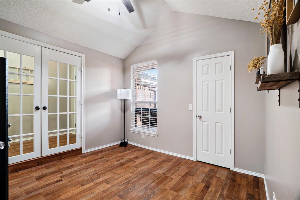 575 Mansfield Road Reno, TX 75462 - Photo 11 of 23 a view of empty room with wooden floor and fan