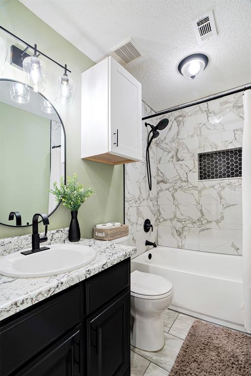 575 Mansfield Road Reno, TX 75462 - Photo 16 of 23 a bathroom with a granite countertop sink toilet and shower