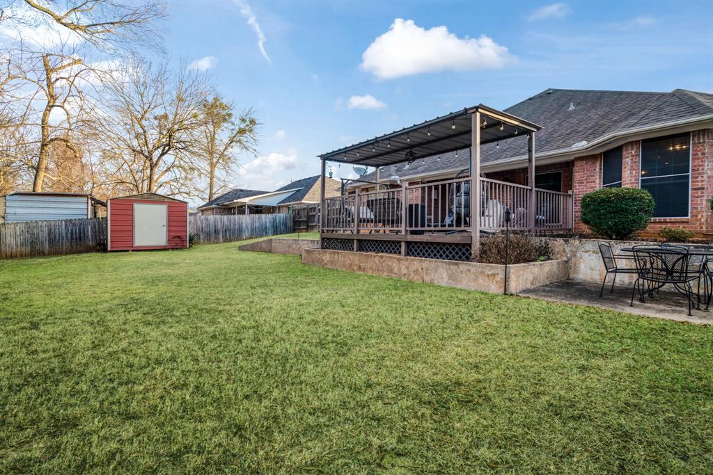 575 Mansfield Road Reno, TX 75462 - Photo 22 of 23 a view of a house with a yard and sitting area