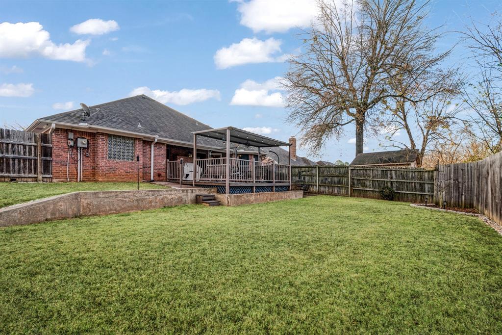 575 Mansfield Road Reno, TX 75462 - Photo 23 of 23 a view of a house with a backyard