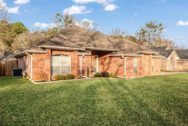 a view of a backyard with table and chairs and potted plants