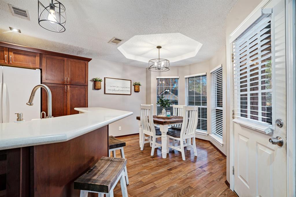 575 Mansfield Road Reno, TX 75462 - Photo 10 of 23 a view of a dining room with furniture window and wooden floor
