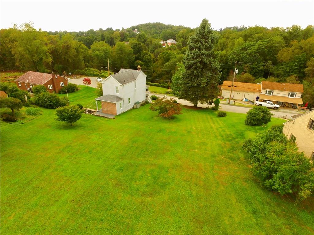 219 Pinchtown Road Pittsburgh, PA 15236 - Photo 23 of 25 This is what we call a Pittsburgh Flat yard. Slight slope, but very useable.
