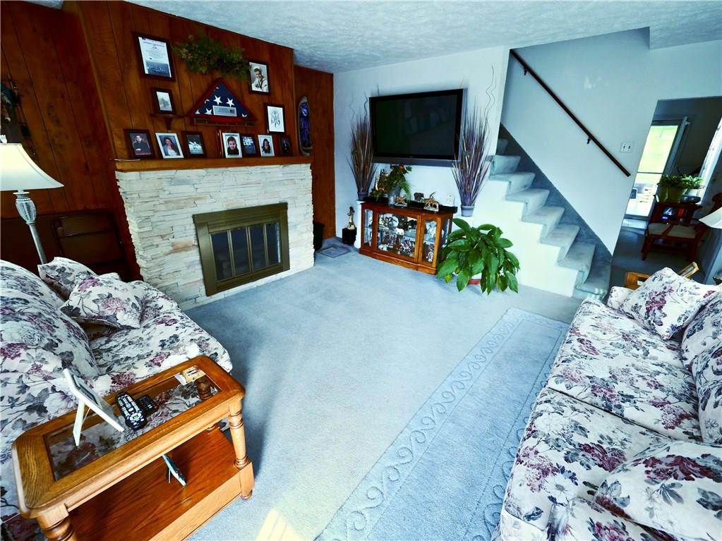 219 Pinchtown Road Pittsburgh, PA 15236 - Photo 5 of 25 Spacious and Bright Living room with Decorative Fireplace.