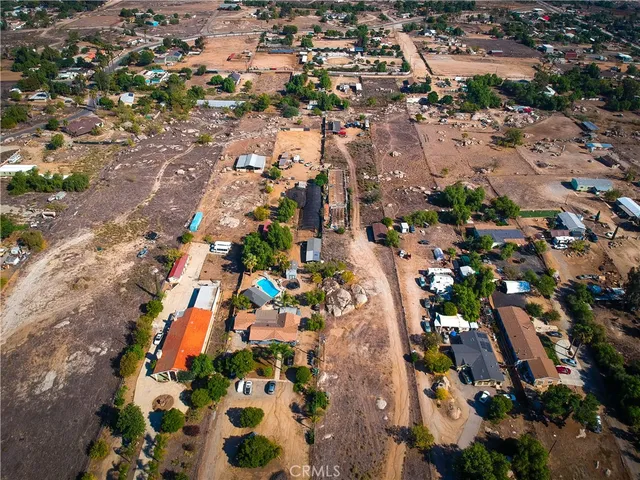 an aerial view of residential houses with outdoor space