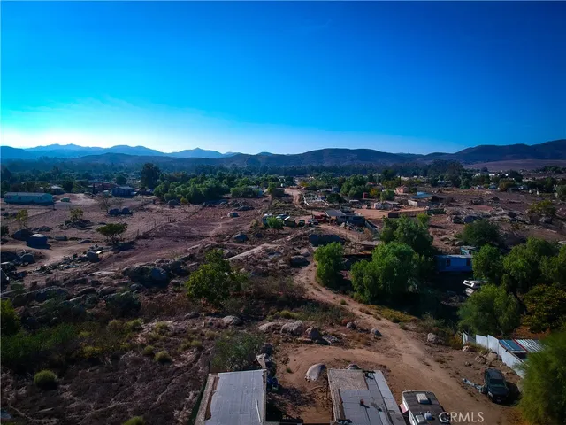 a view of a city street next to a yard