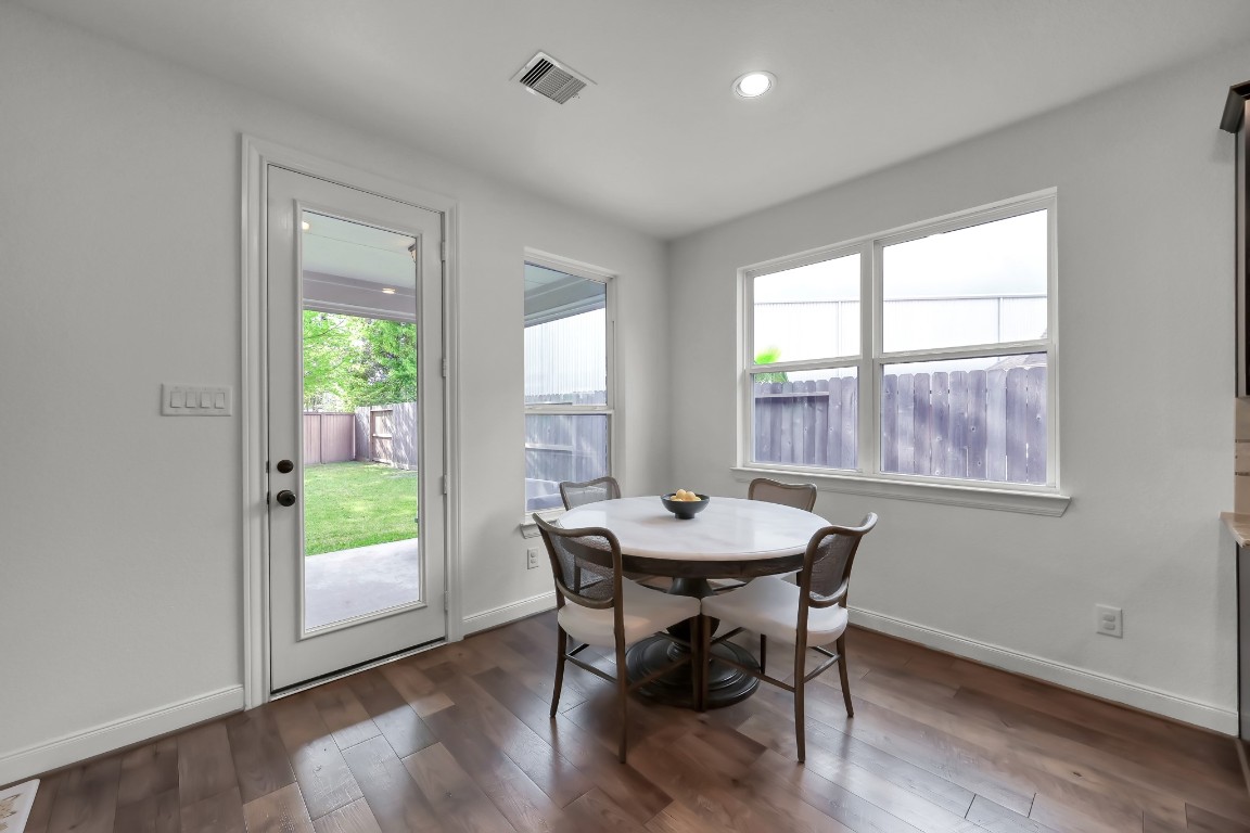 22202 Weller Oaks Drive Spring, TX 77389 - Photo 12 of 39 a view of a dining room with furniture window and wooden floor