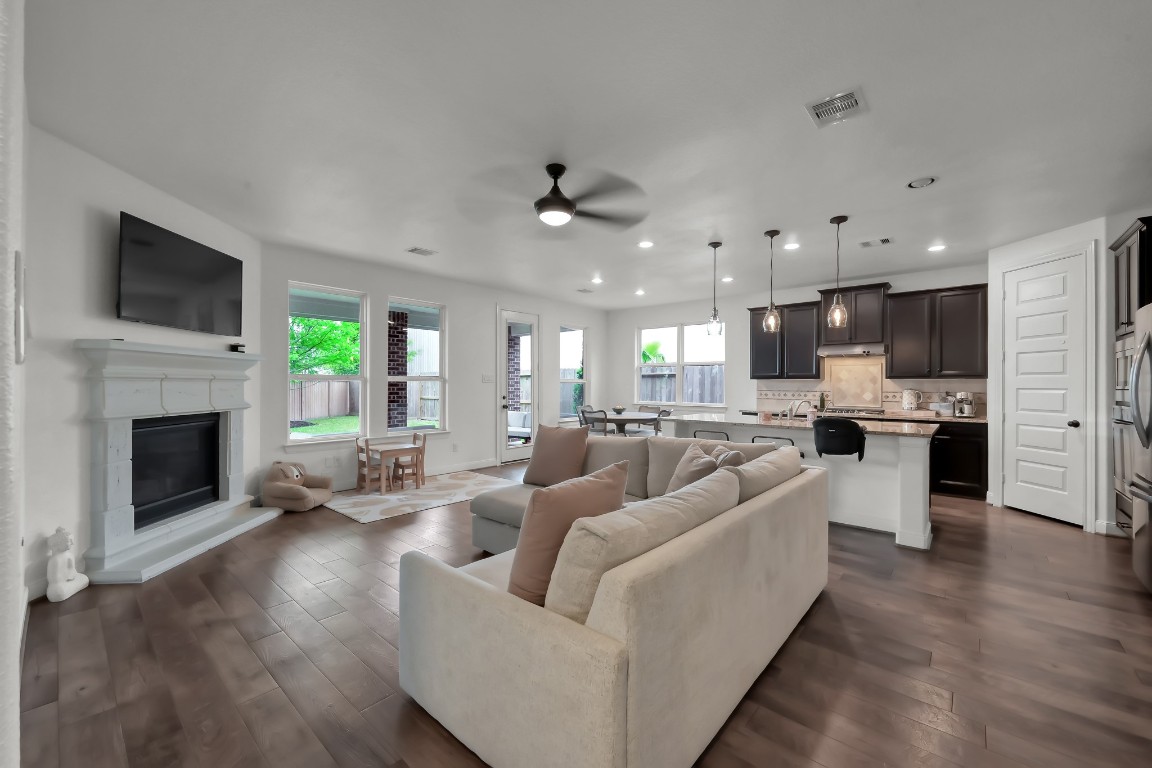22202 Weller Oaks Drive Spring, TX 77389 - Photo 14 of 39 a living room with furniture fireplace and flat screen tv