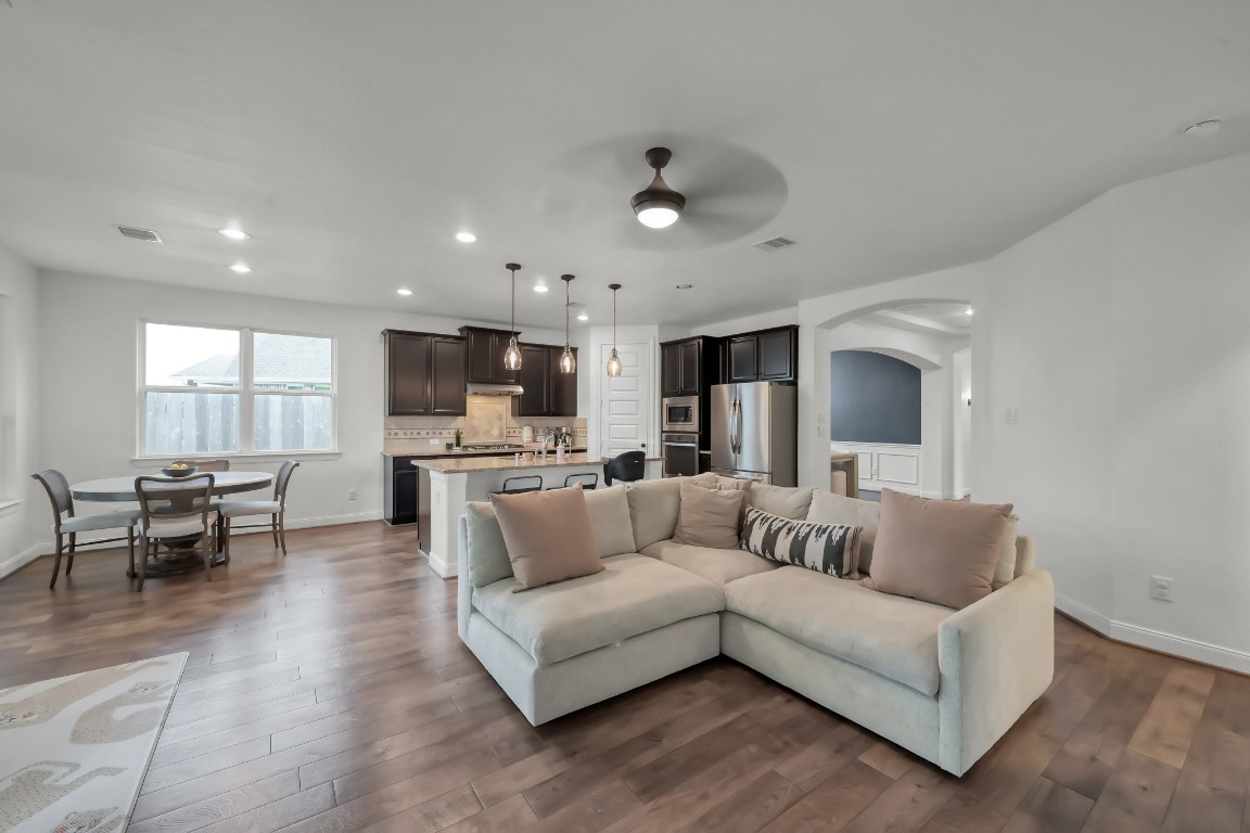 22202 Weller Oaks Drive Spring, TX 77389 - Photo 15 of 39 a living room with furniture and kitchen view
