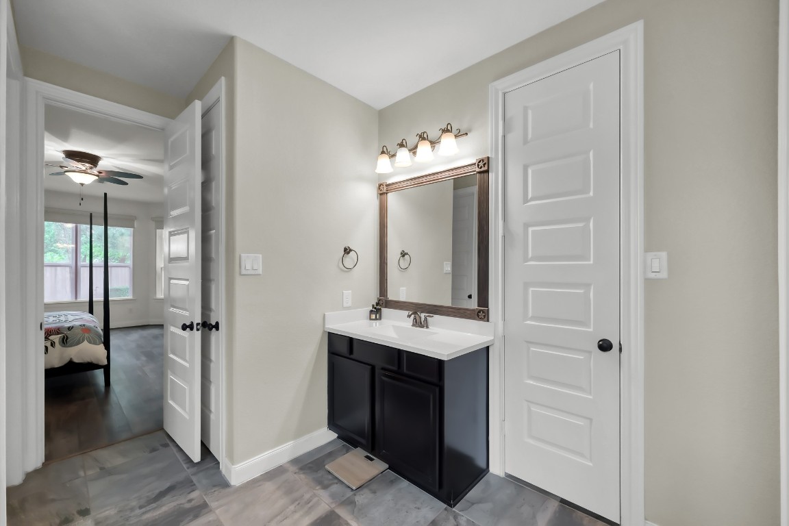 22202 Weller Oaks Drive Spring, TX 77389 - Photo 20 of 39 a spacious bathroom with a sink and a mirror