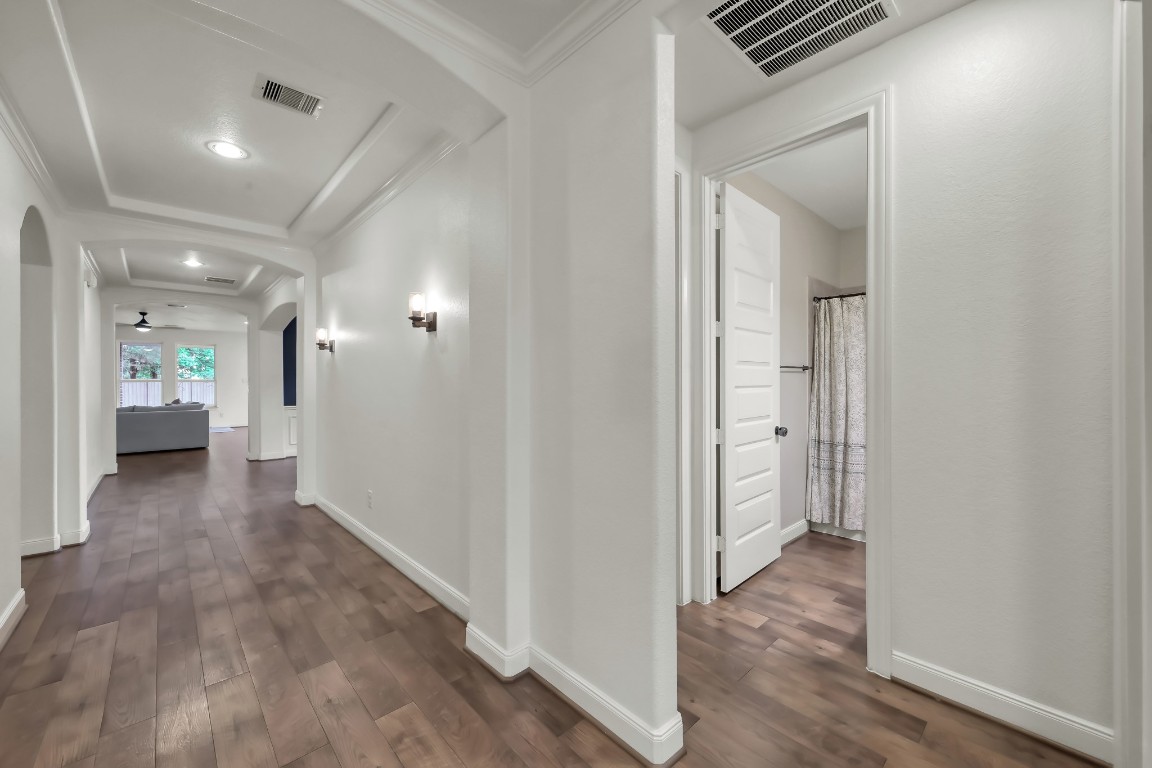22202 Weller Oaks Drive Spring, TX 77389 - Photo 25 of 39 a view of a hallway with wooden floor