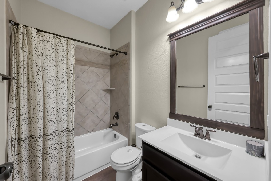 22202 Weller Oaks Drive Spring, TX 77389 - Photo 30 of 39 a bathroom with a sink toilet and shower