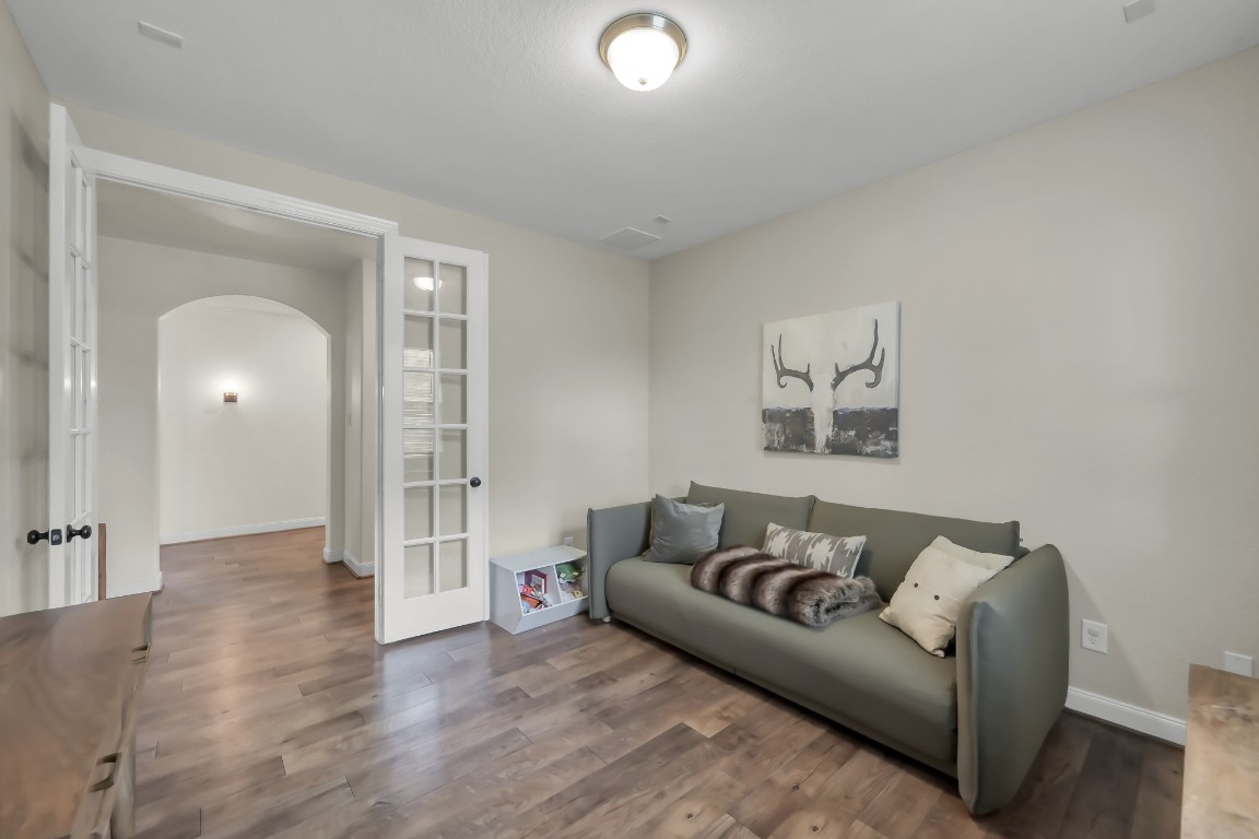 22202 Weller Oaks Drive Spring, TX 77389 - Photo 33 of 39 a living room with furniture and a wooden floor
