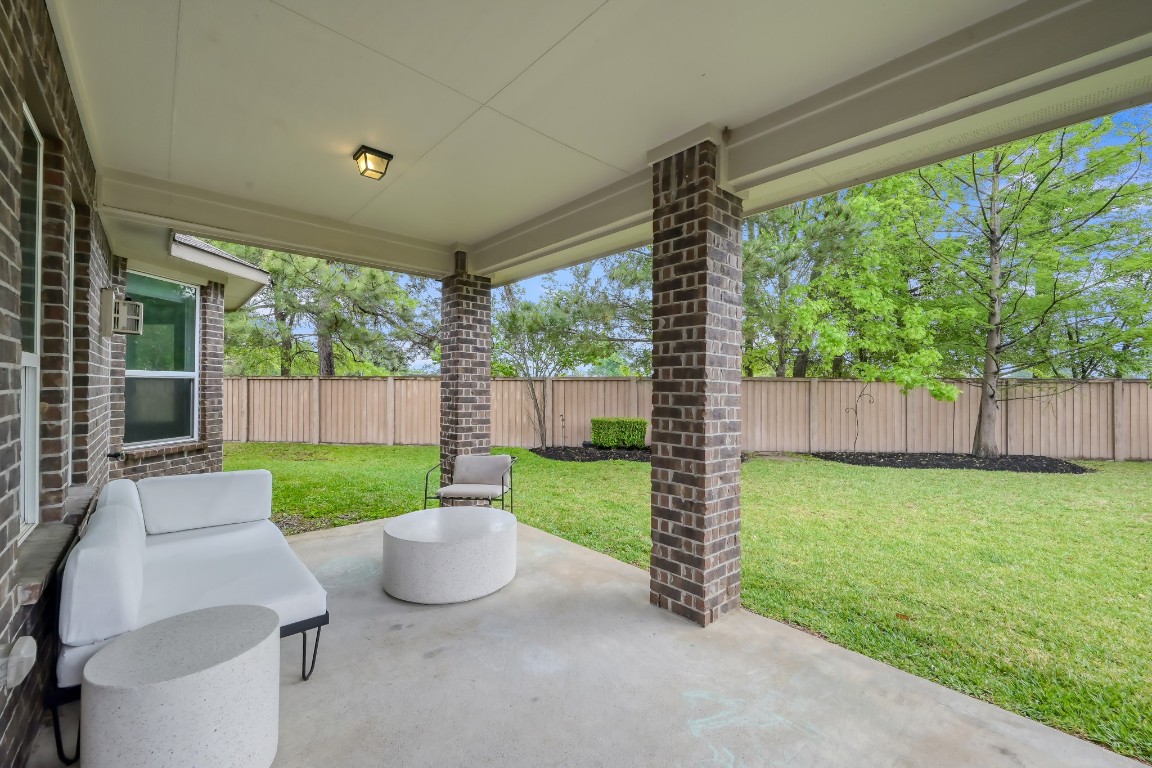 22202 Weller Oaks Drive Spring, TX 77389 - Photo 35 of 39 a garden view with a seating space