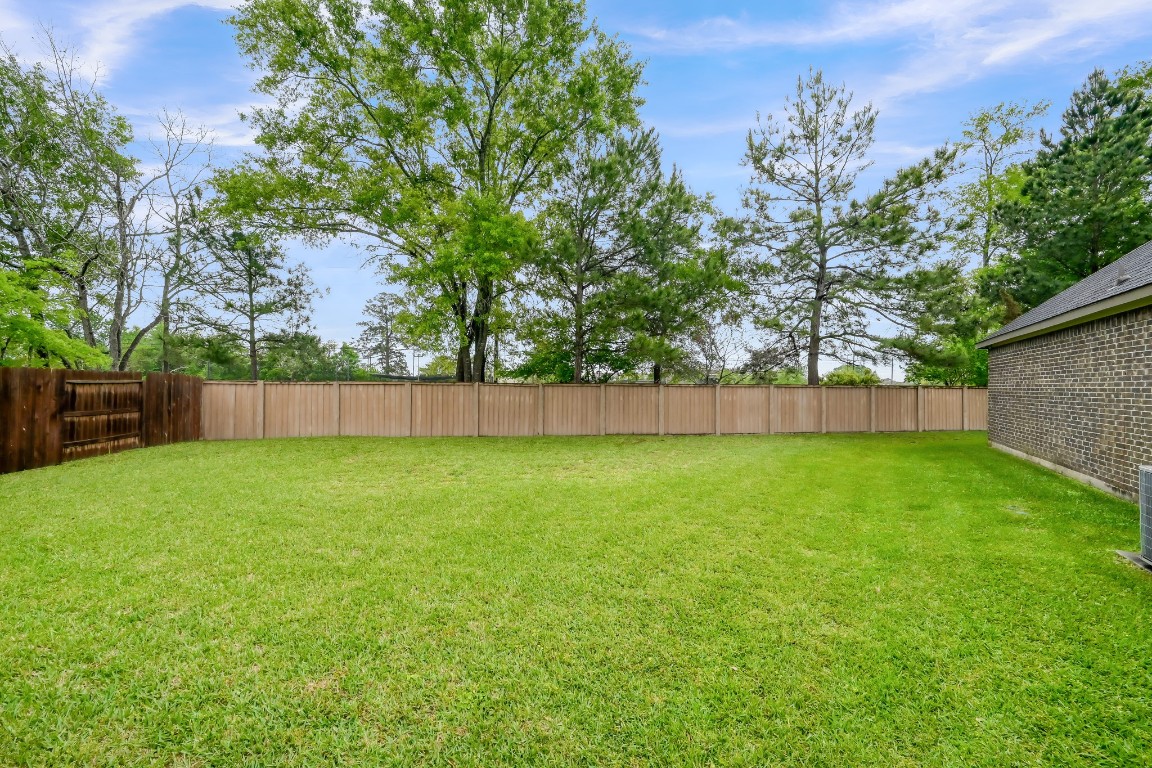 22202 Weller Oaks Drive Spring, TX 77389 - Photo 39 of 39 a view of outdoor space with deck and yard