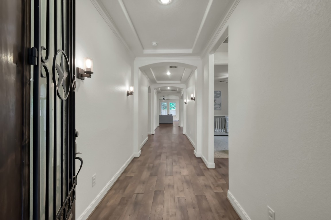 22202 Weller Oaks Drive Spring, TX 77389 - Photo 4 of 39 a view of hallway with wooden floor
