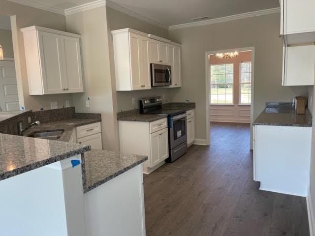 1510 Jack Davis Road Monroe, NC 28112 - Photo 6 of 22 a kitchen with granite countertop a sink and a stove top oven