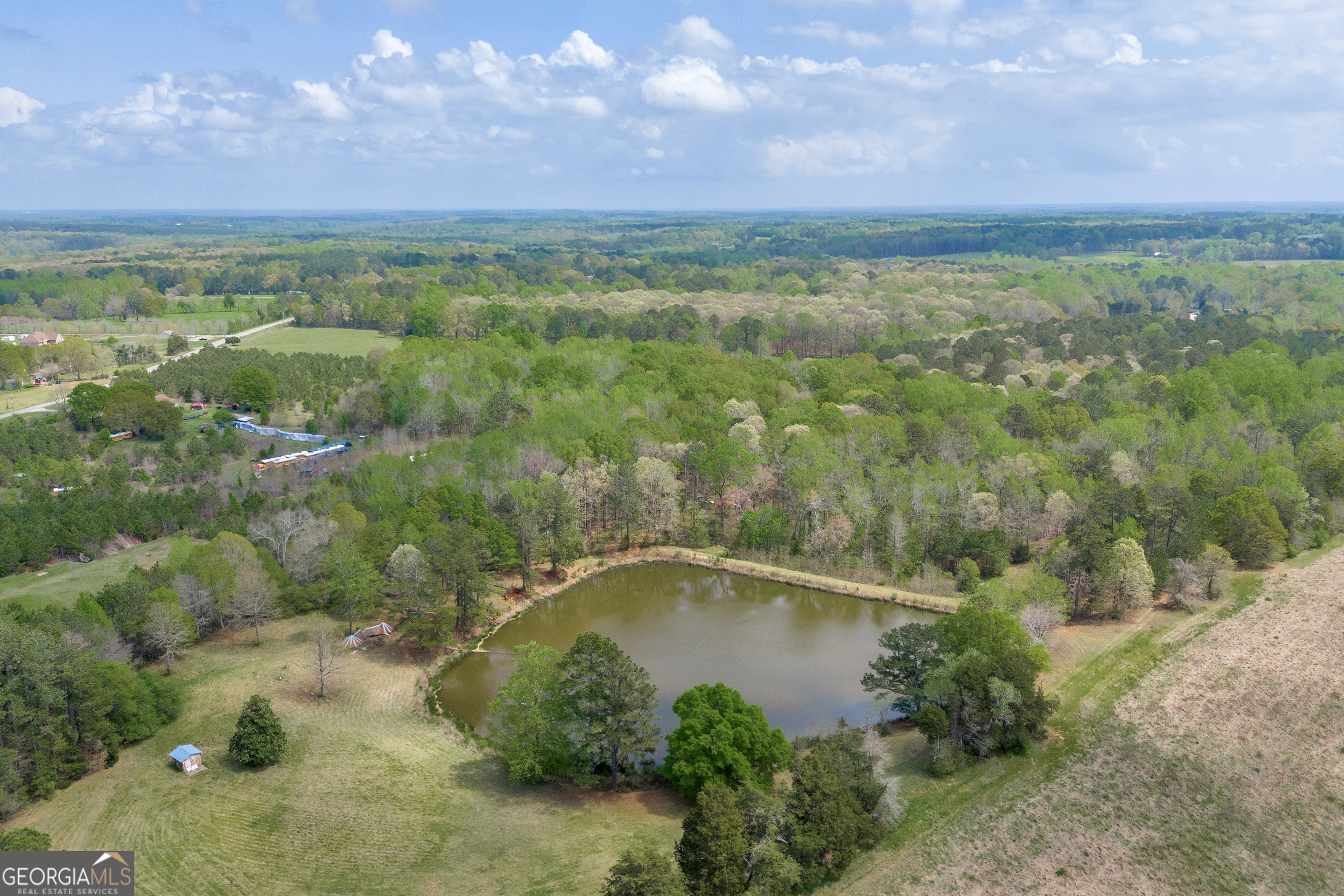 104 Howington Road Winterville, GA 30683 - Photo 19 of 74 a view of a city with lush green forest
